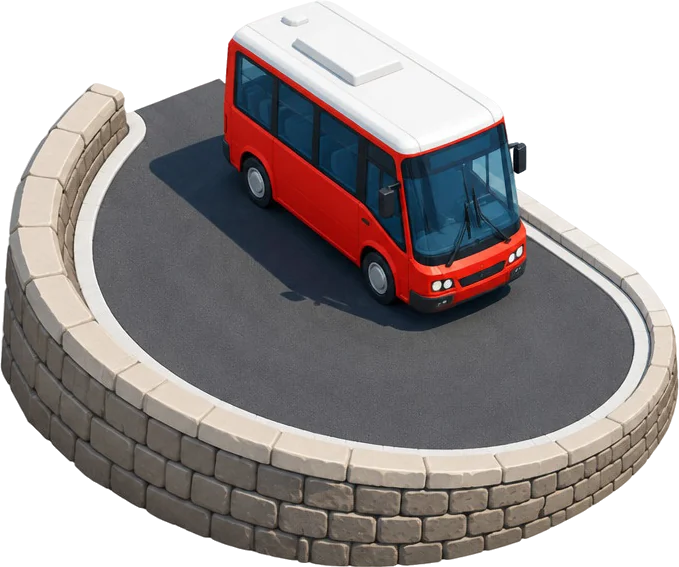 Bus kecil merah beratap putih menikung di potongan jalan berbentuk U dengan dinding batu penahan.